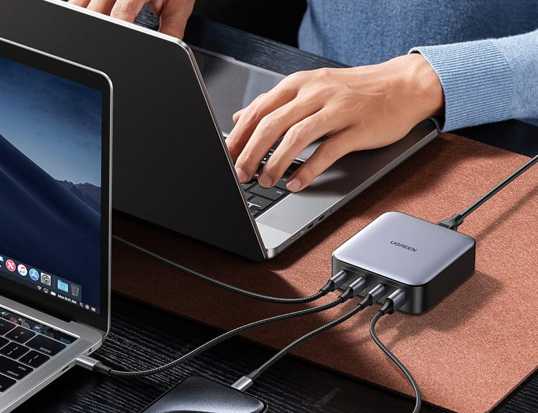 UGREEN Nexode GaN charger powering a laptop on a desk