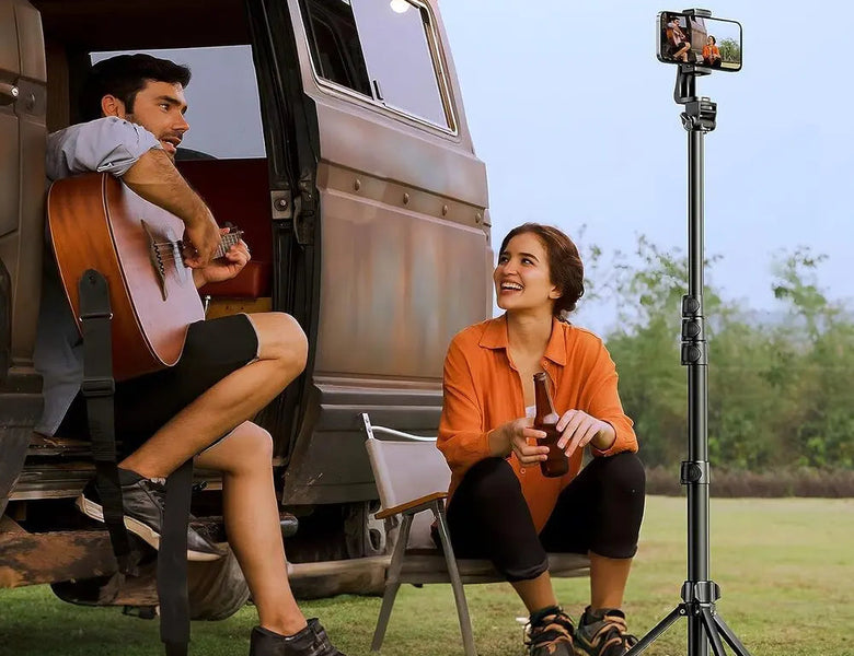 Couple outdoors filming with a UGREEN tripod selfie stick