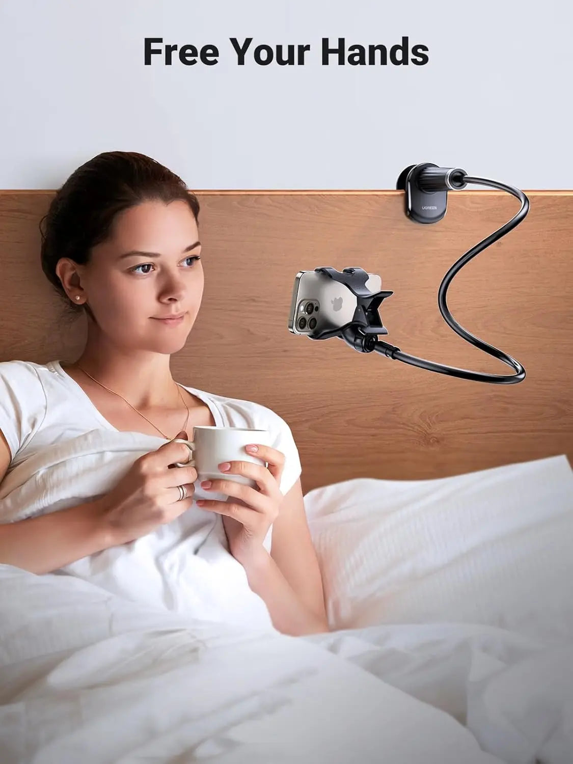UGREEN flexible long-arm phone holder attached to a bed headboard