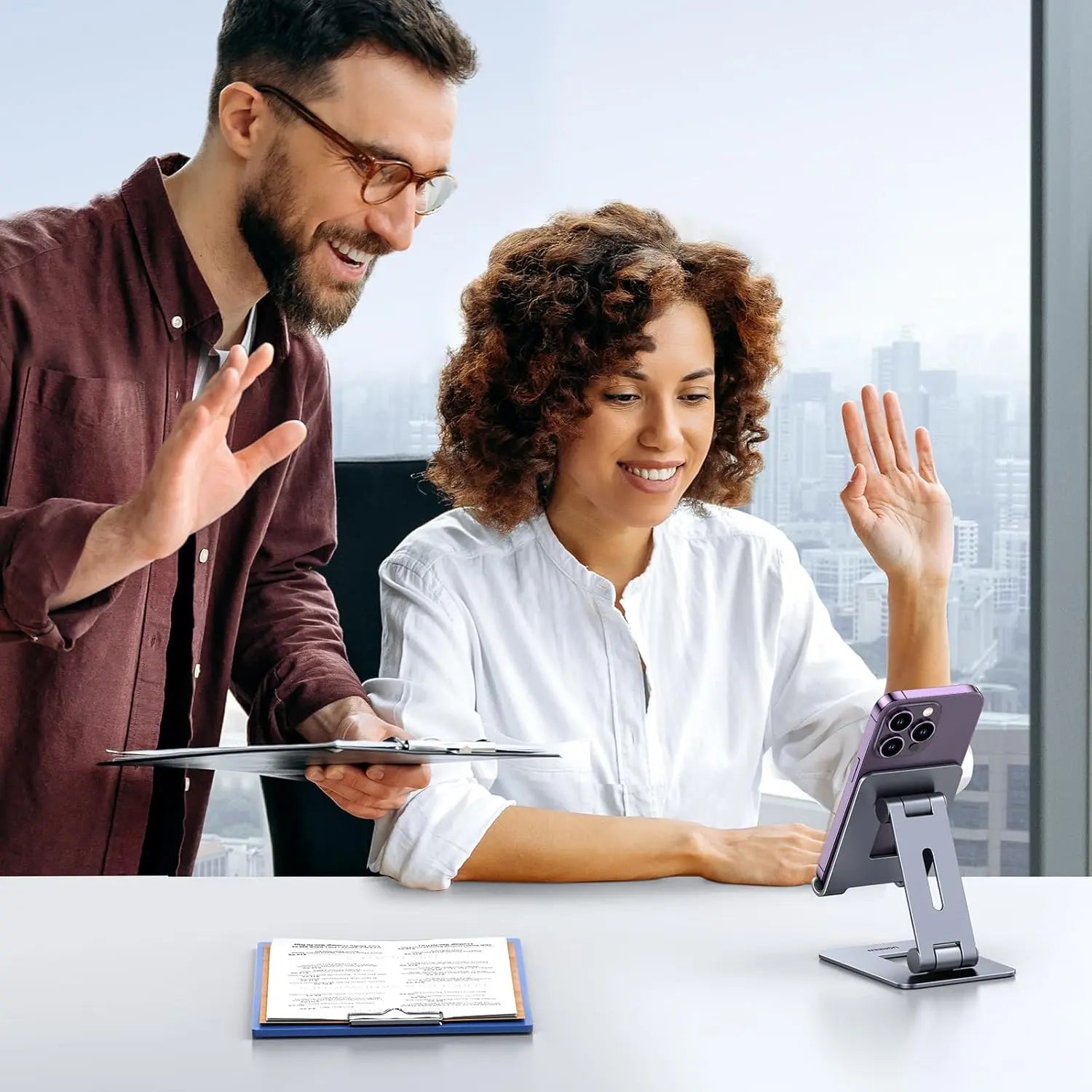 UGREEN LP678 desktop smartphone stand being used for a hands-free online video meeting
