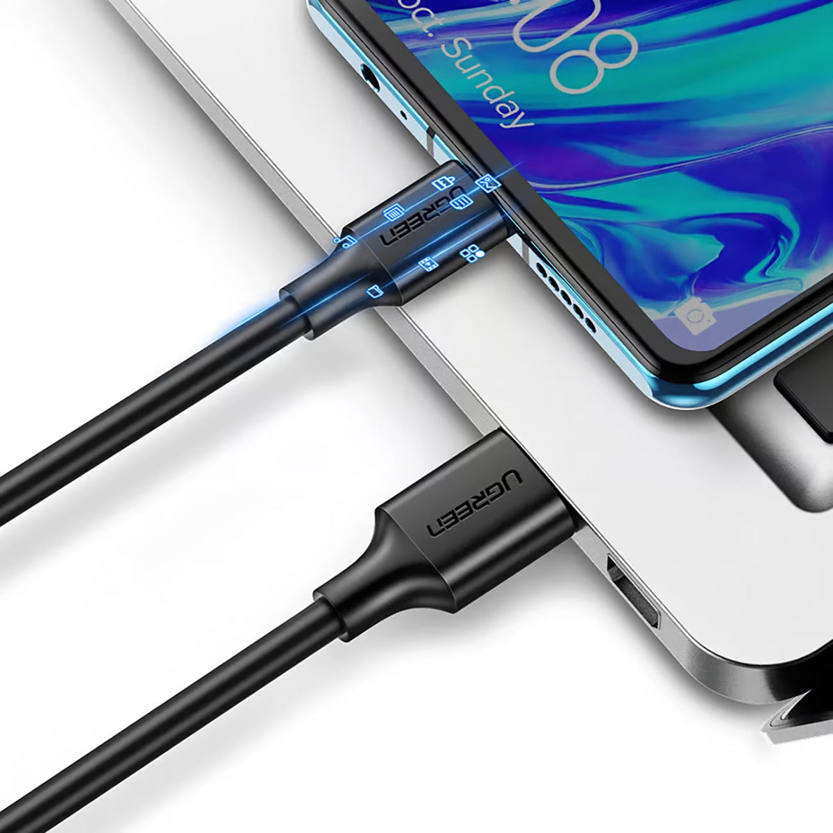 UGREEN US184 cable connecting a USB-C phone to a USB-A computer