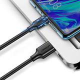 UGREEN US184 cable connecting a USB-C phone to a USB-A computer