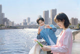 UGREEN MagFlow Air 5000mAh Starlight Blue power bank in an outdoor phone-use scene