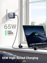 UGREEN 65W travel charger fast charging a MacBook Air from a wall socket